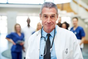 Portrait of adult cheerful doctor in hospital