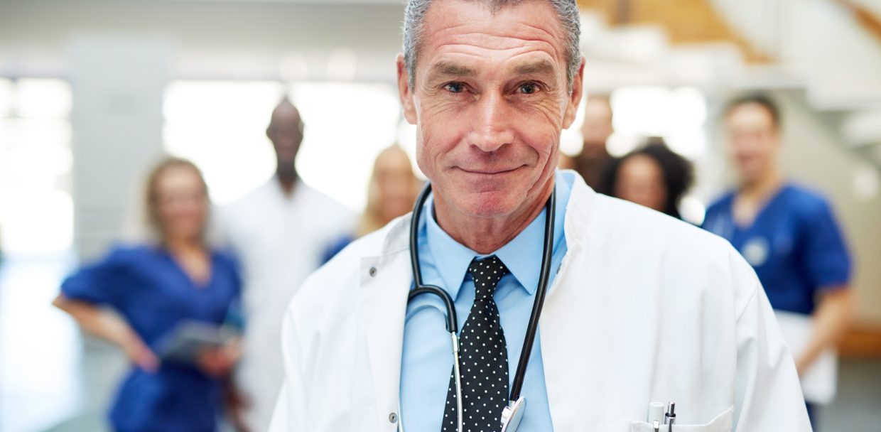 Portrait of adult cheerful doctor in hospital